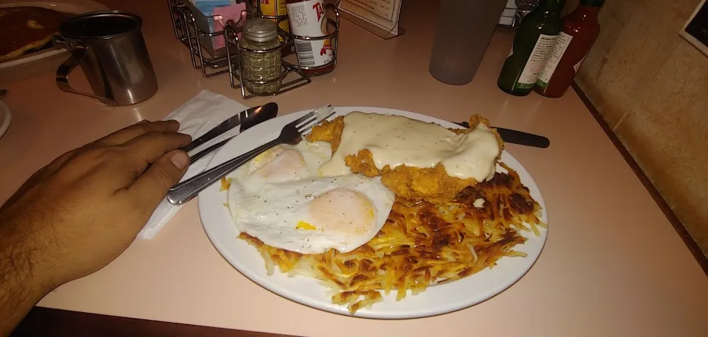 Country Fried Chicken with 2 Eggs over Easy with a Side of Hashbrowns