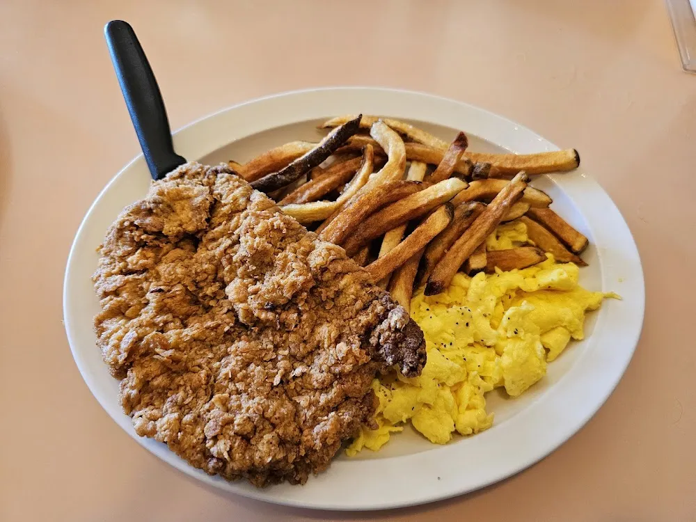 Scrambled Eggs Chicken Fried Steak and Fries
